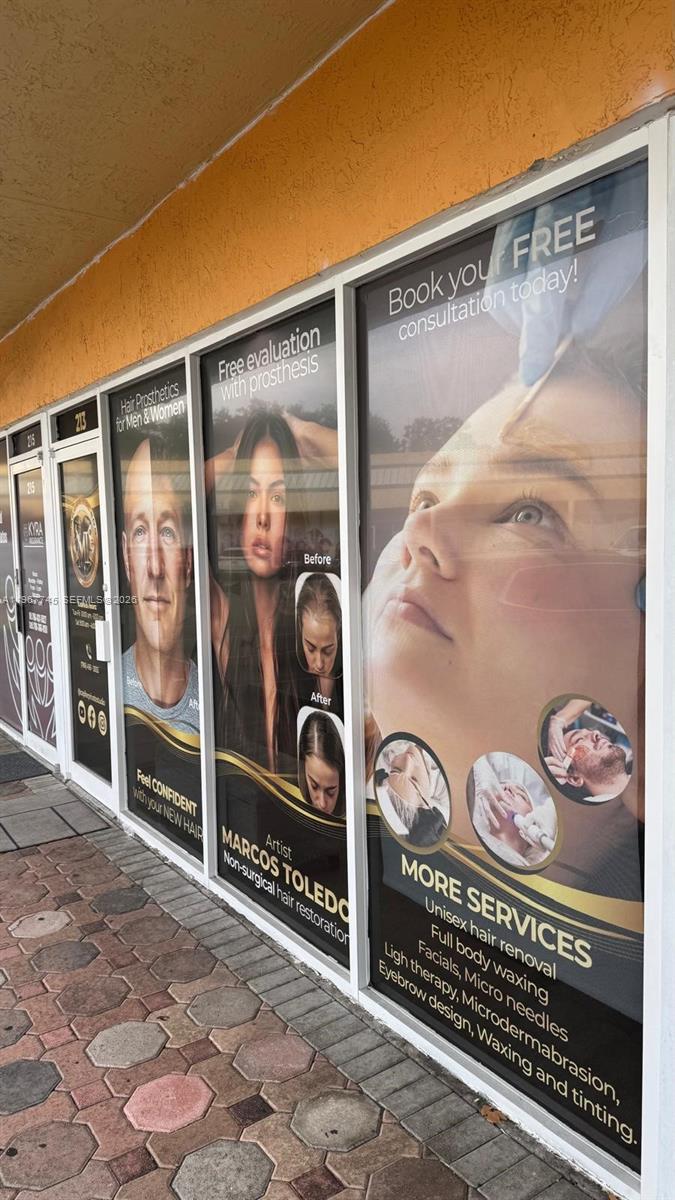 The exterior of a storefront features large window advertisements for hair restoration and beauty services — 213 Park Blvd, Miami FL 33126, MIAMI, FL