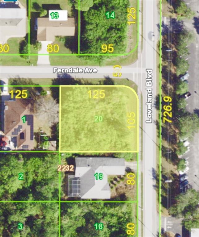 This is an aerial map showing a vacant corner lot highlighted in yellow — 2035 LOVELAND BOULEVARD, PORT CHARLOTTE, FL