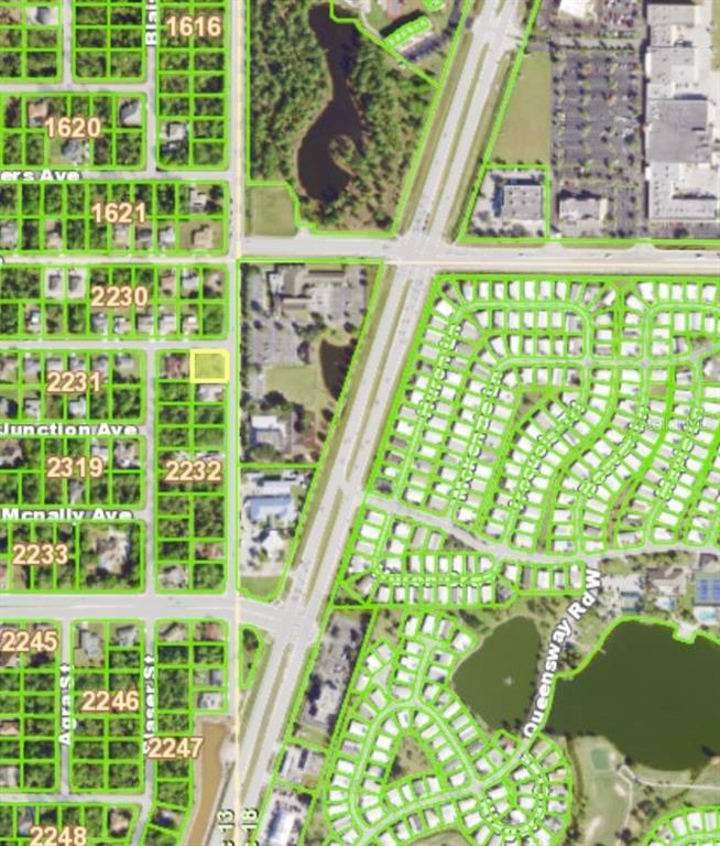 This is an aerial map showing residential parcels, roads, and a commercial area — 2035 LOVELAND BOULEVARD, PORT CHARLOTTE, FL