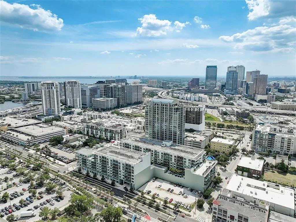 An aerial view of a dense urban cityscape featuring high-rise buildings and parking lots — 111 N 12TH STREET UNIT 1620, TAMPA, FL