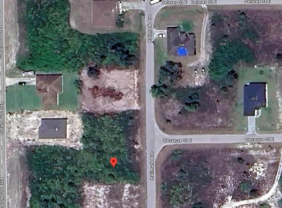 This is a satellite map view of a residential neighborhood with vacant and developed lots — 1118 HALLMARK AVENUE, LEHIGH ACRES, FL
