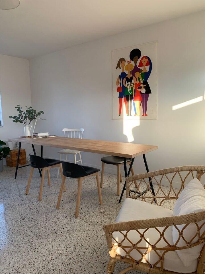 A dining area features a long wooden table, modern chairs, and a colorful wall tapestry — 649 SW 9th Street # 301, Miami FL 33130, MIAMI, FL