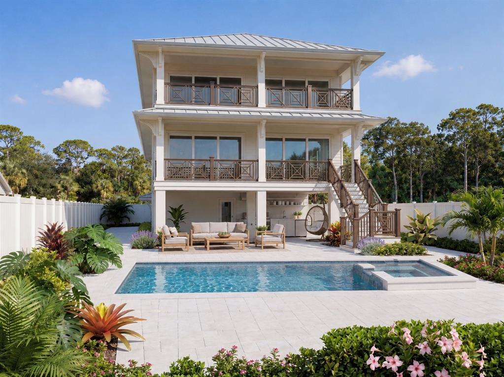 A three-story house with balconies overlooks a backyard swimming pool and patio area — 4185 ROBERTS POINT CIRCLE LOT 19, SARASOTA, FL