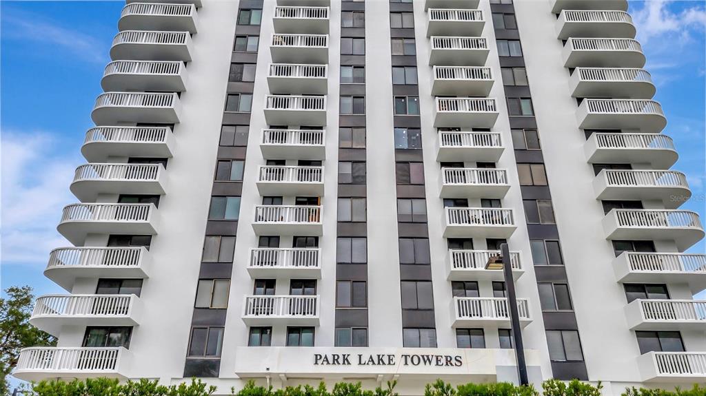 The exterior of the Park Lake Towers high-rise building features stacked white balconies — 400 E COLONIAL DRIVE UNIT 1609, ORLANDO, FL