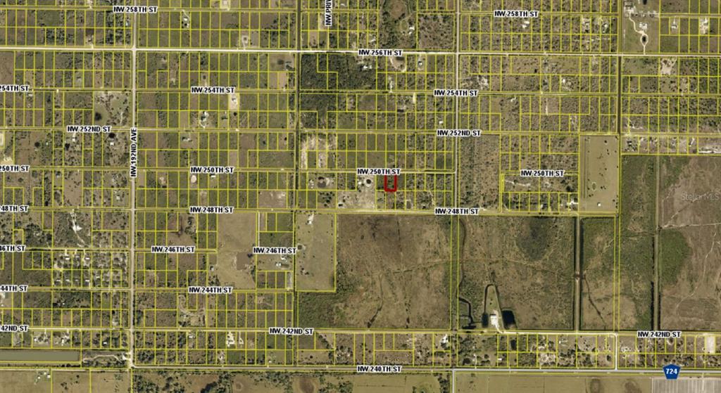 This is an aerial map showing a highlighted property lot within a grid of streets — 17926 NW 250TH STREET, OKEECHOBEE, FL