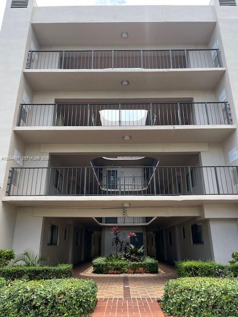 A multi-story apartment building exterior features stacked balconies with black metal railings — 8540 SW 133rd Ave Rd # 123, Miami FL 33183, MIAMI, FL