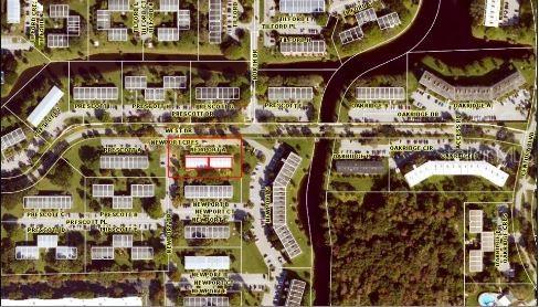This is an aerial map showing residential buildings, streets, and a canal in a neighborhood — 19 NEWPORT A, DEERFIELD BEACH, FL