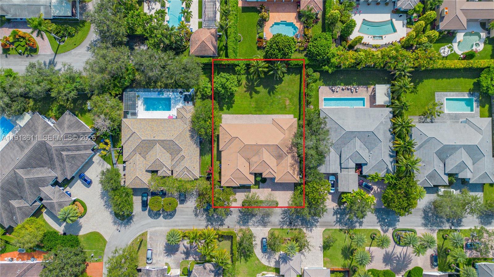 An aerial view shows a single-family home with a tiled roof and a backyard lawn — 9424 SW 123rd Ter, Miami FL 33176, MIAMI, FL