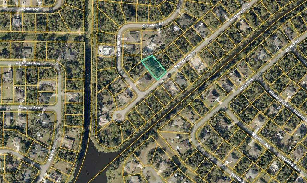 This is an aerial map showing a vacant lot highlighted in teal within a residential neighborhood — HENDERSON LANE, NORTH PORT, FL
