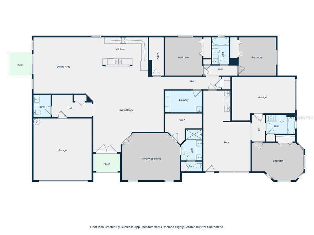 This is a floor plan of a house featuring multiple bedrooms, bathrooms, and two garages — 6401 FELICE AVENUE, TAMPA, FL