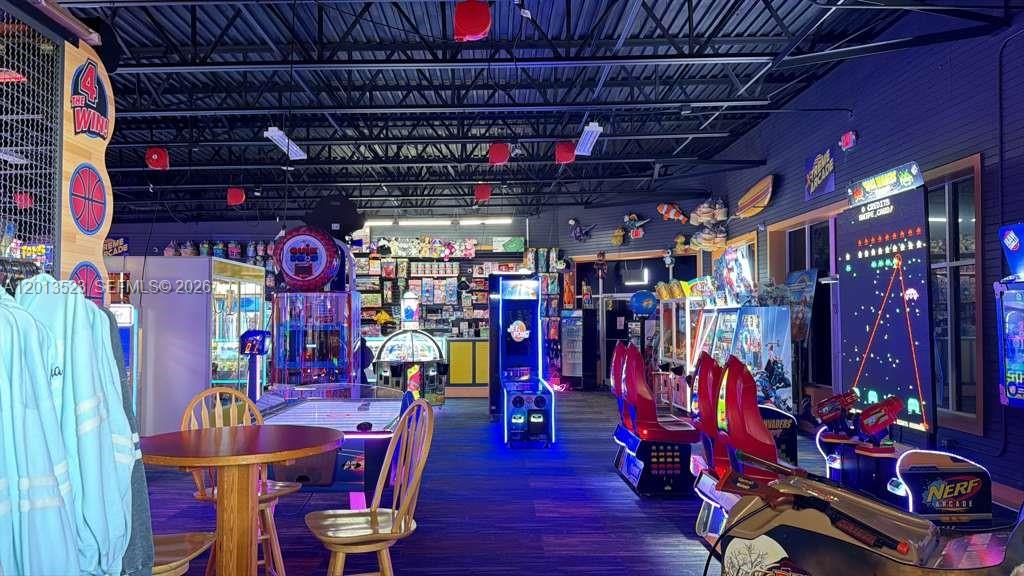 An indoor arcade features various gaming machines, a small dining table, and a prize counter — 40194 Tuna Ter, NC 27915, NC