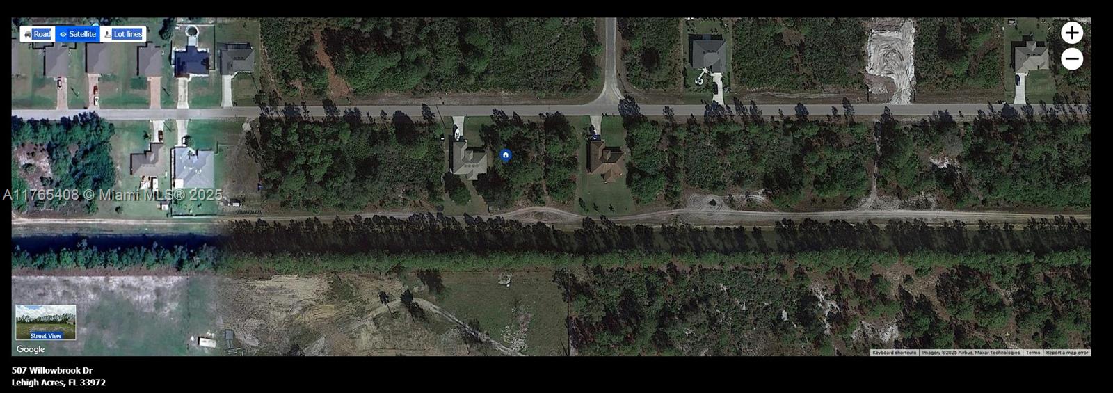 This is a satellite map view showing houses along a road with surrounding wooded areas — 507 Willowbrook Dr., Lehigh Acres FL 33972, LEHIGH ACRES, FL