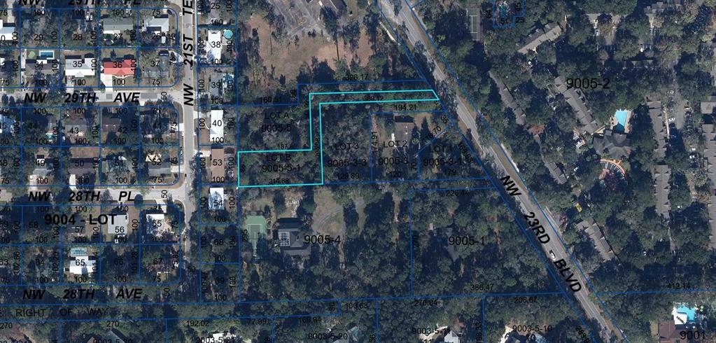 This is an aerial map showing property parcel boundaries highlighted in blue — 0 NW 23RD BOULEVARD, GAINESVILLE, FL