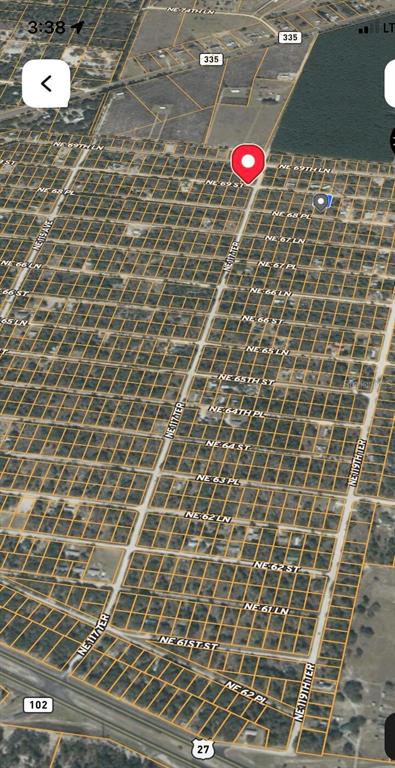 This is an aerial map view showing a residential grid of streets and land parcels — NE 69TH STREET, WILLISTON, FL