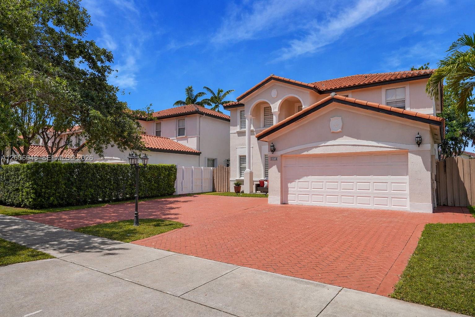 A two-story house with a red-tiled roof and a red brick driveway — 6114 SW 158th Pass, Miami FL 33193, MIAMI, FL