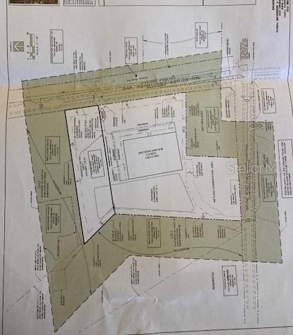 This is a site plan map showing a proposed building envelope and surrounding land parcels — 18040 GUNN HIGHWAY, ODESSA, FL