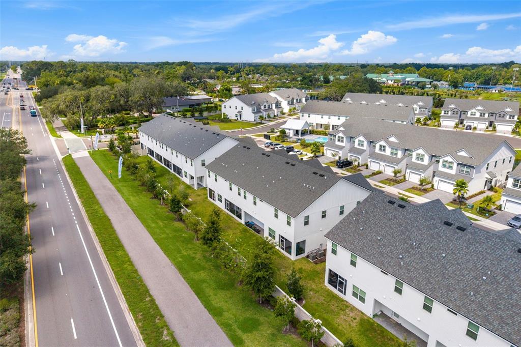 An aerial view shows a townhome unit highlighted within a white rectangle — 1445 BROOKDALE COURT, OVIEDO, FL