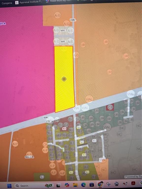 This is a digital zoning map showing a highlighted yellow parcel of land — PR 2 KM. 115.5, AGUADILLA, PR