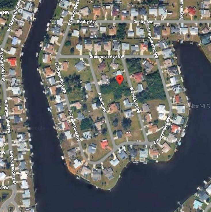 This is an aerial map view of a residential lot marked with a red pin — 234 WARWICK STREET NW, PORT CHARLOTTE, FL