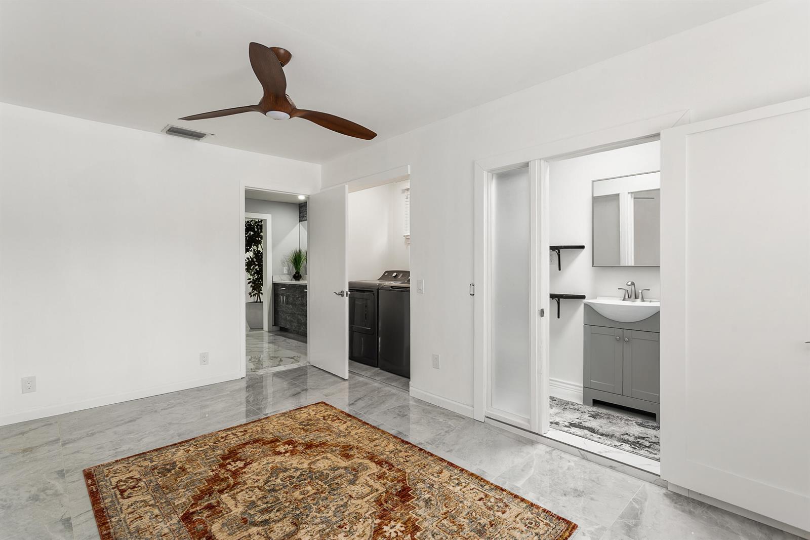 A single-story white house with a flat roof, palm trees, and a concrete driveway — 3141 NE 14th Avenue, Pompano Beach FL 33064, POMPANO BEACH, FL