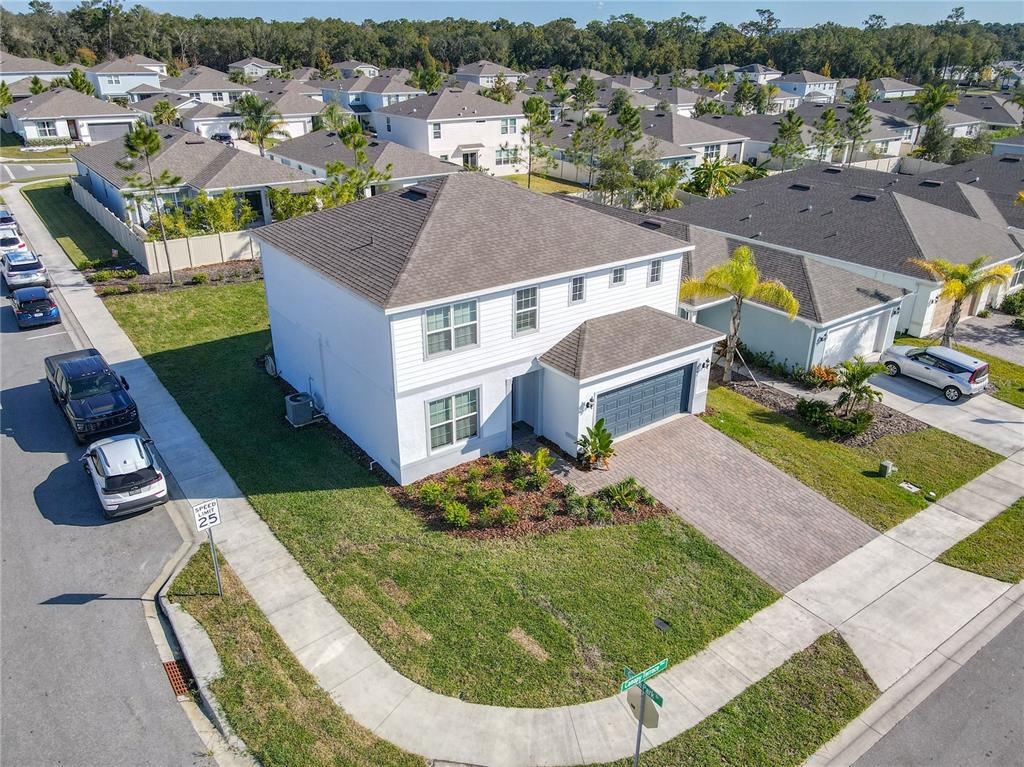 A two-story house exterior features a gray garage door, a dark front door, and pavers — 2248 CANOPY TERRACE BOULEVARD, DELAND, FL