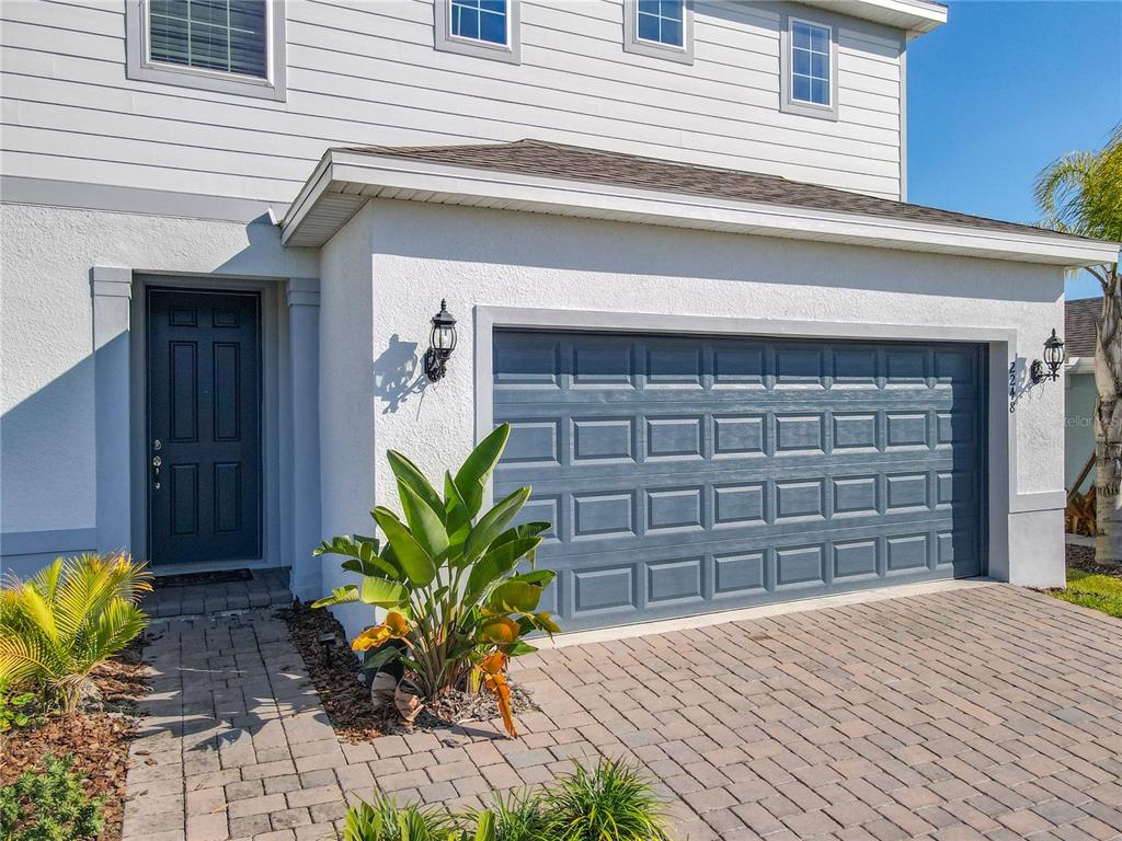 An aerial view of a two-story suburban house with a paved driveway and garage — 2248 CANOPY TERRACE BOULEVARD, DELAND, FL
