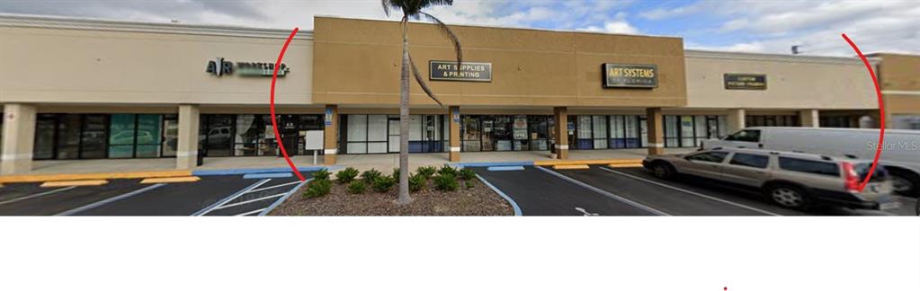 A commercial strip mall storefront with a tan facade and a palm tree in front — 1740 STATE ROAD 436, WINTER PARK, FL