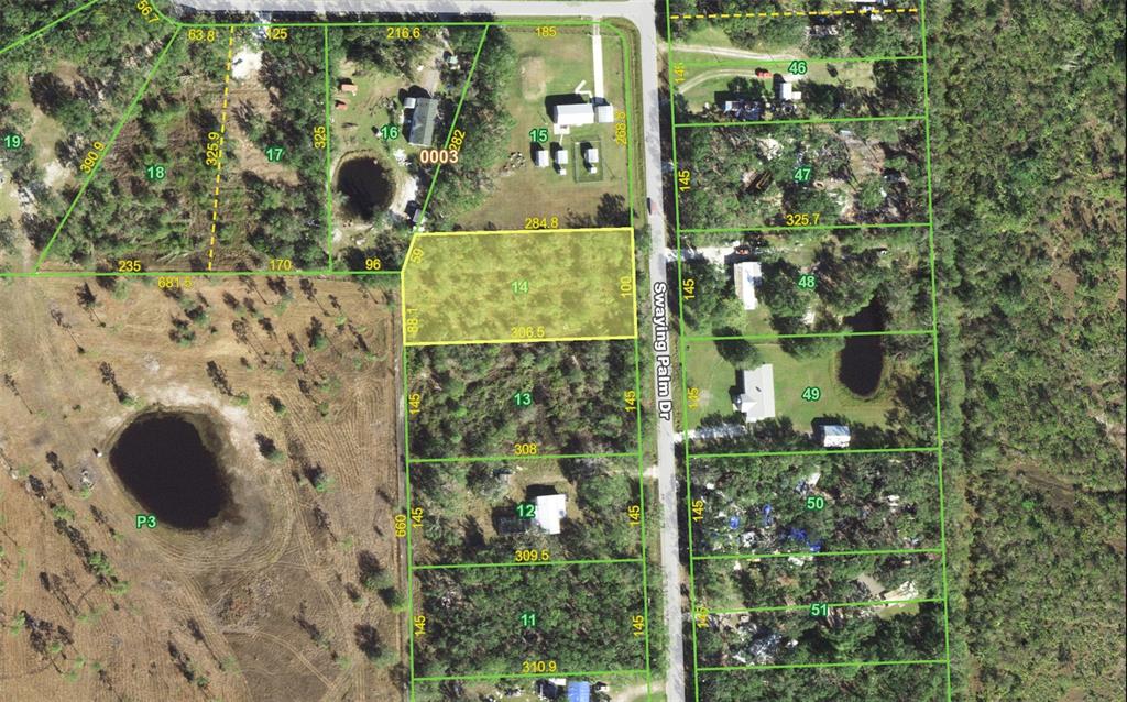 This is an aerial map showing property lot lines and parcel numbers for a residential area — 5695 SWAYING PALM DRIVE, PUNTA GORDA, FL