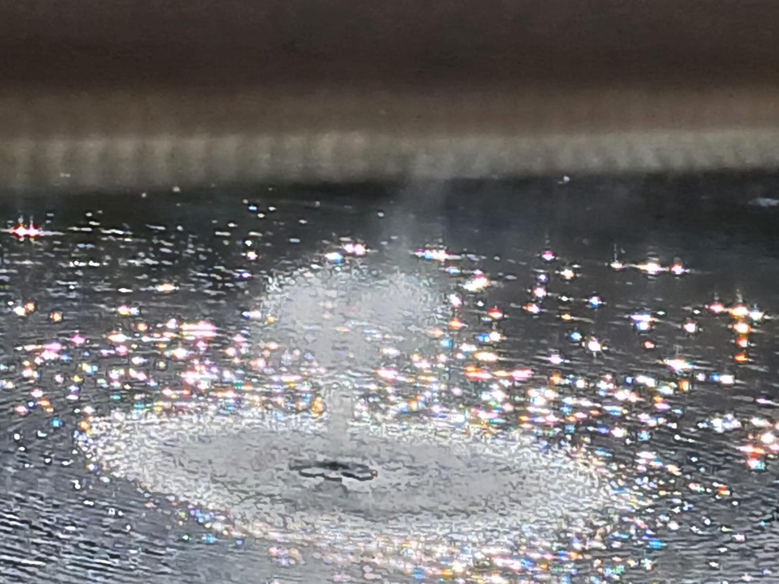 A small water fountain creates ripples and light reflections on the surface of a pool — 721 Lori Drive # 309, Palm Springs FL 33461, PALM SPRINGS, FL