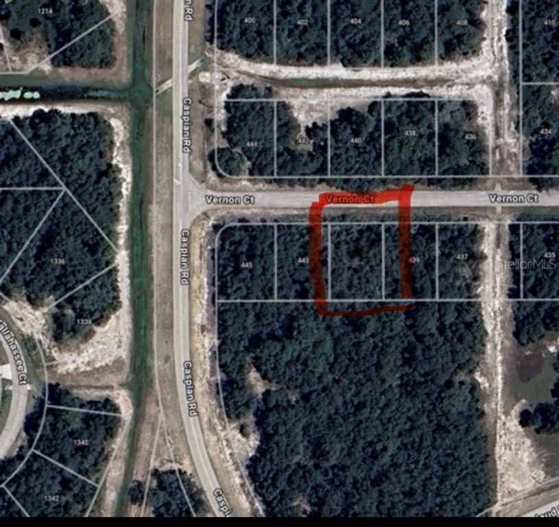 An aerial map view shows two adjacent vacant lots outlined in red on Vernon Court — 441 VERNON COURT, KISSIMMEE, FL