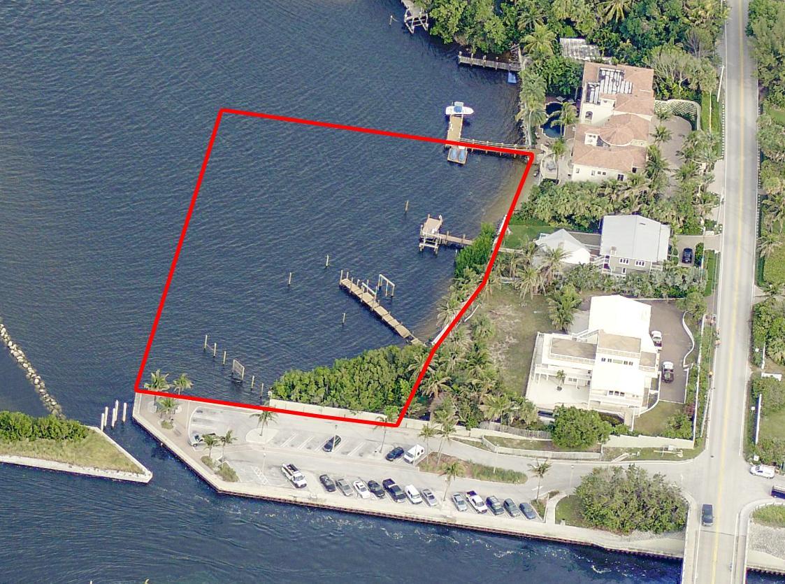 An aerial view shows a waterfront property lot outlined in red next to a parking area — 4000 S Ocean Boulevard, Manalapan FL 33462, MANALAPAN, FL