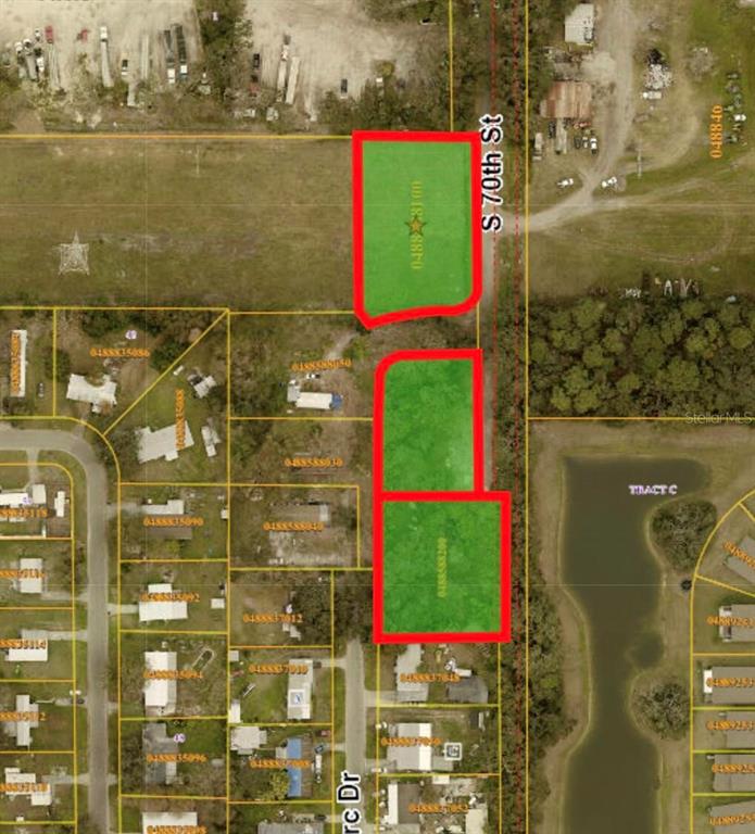 This is an aerial map showing three highlighted parcels of land along a road — 4415 S 70TH STREET, TAMPA, FL