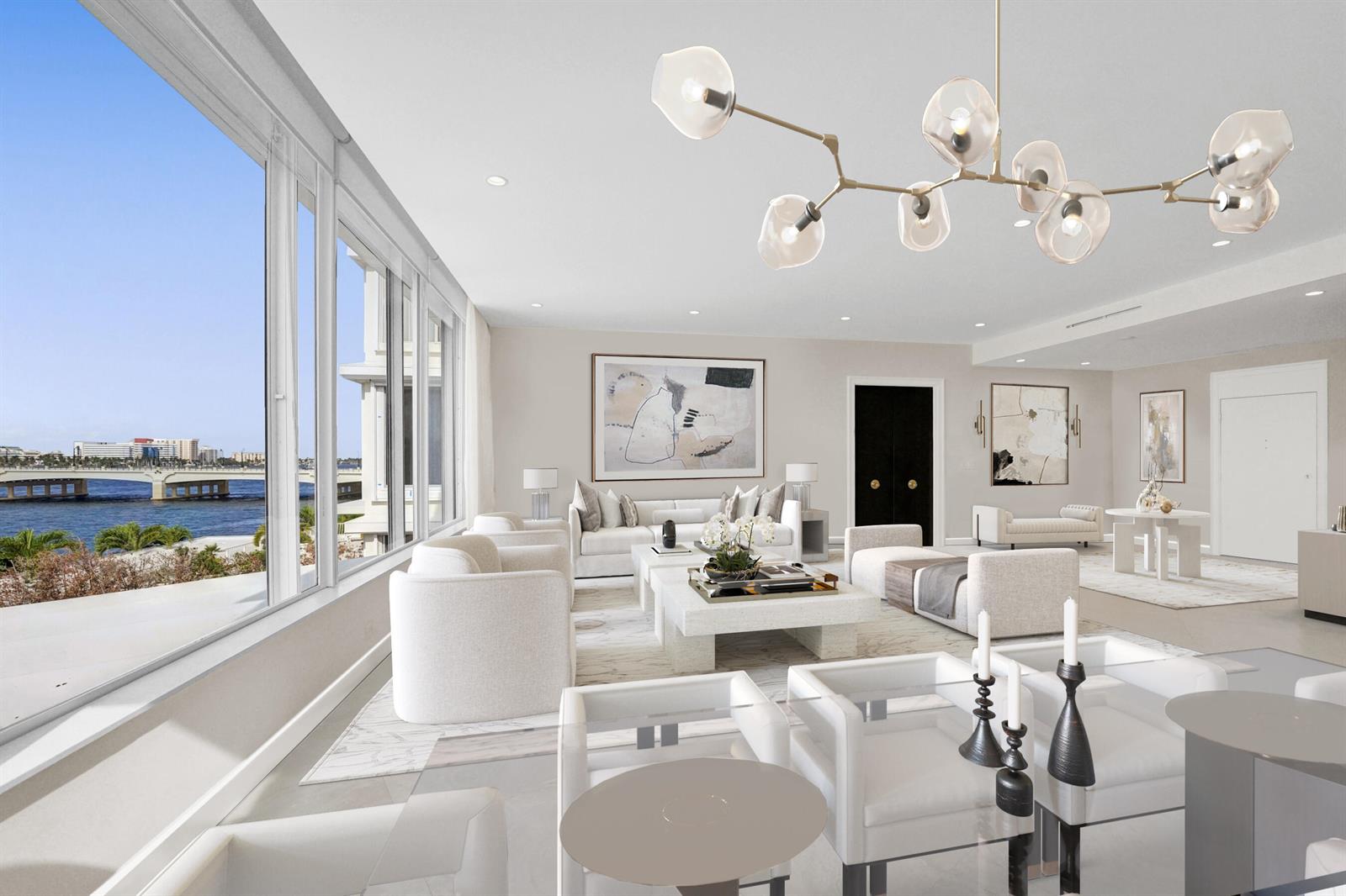 A bright, modern living room features white furniture, a sculptural chandelier, and floor-to-ceiling waterfront views — 44 Cocoanut Row, Palm Beach FL 33480, PALM BEACH, FL