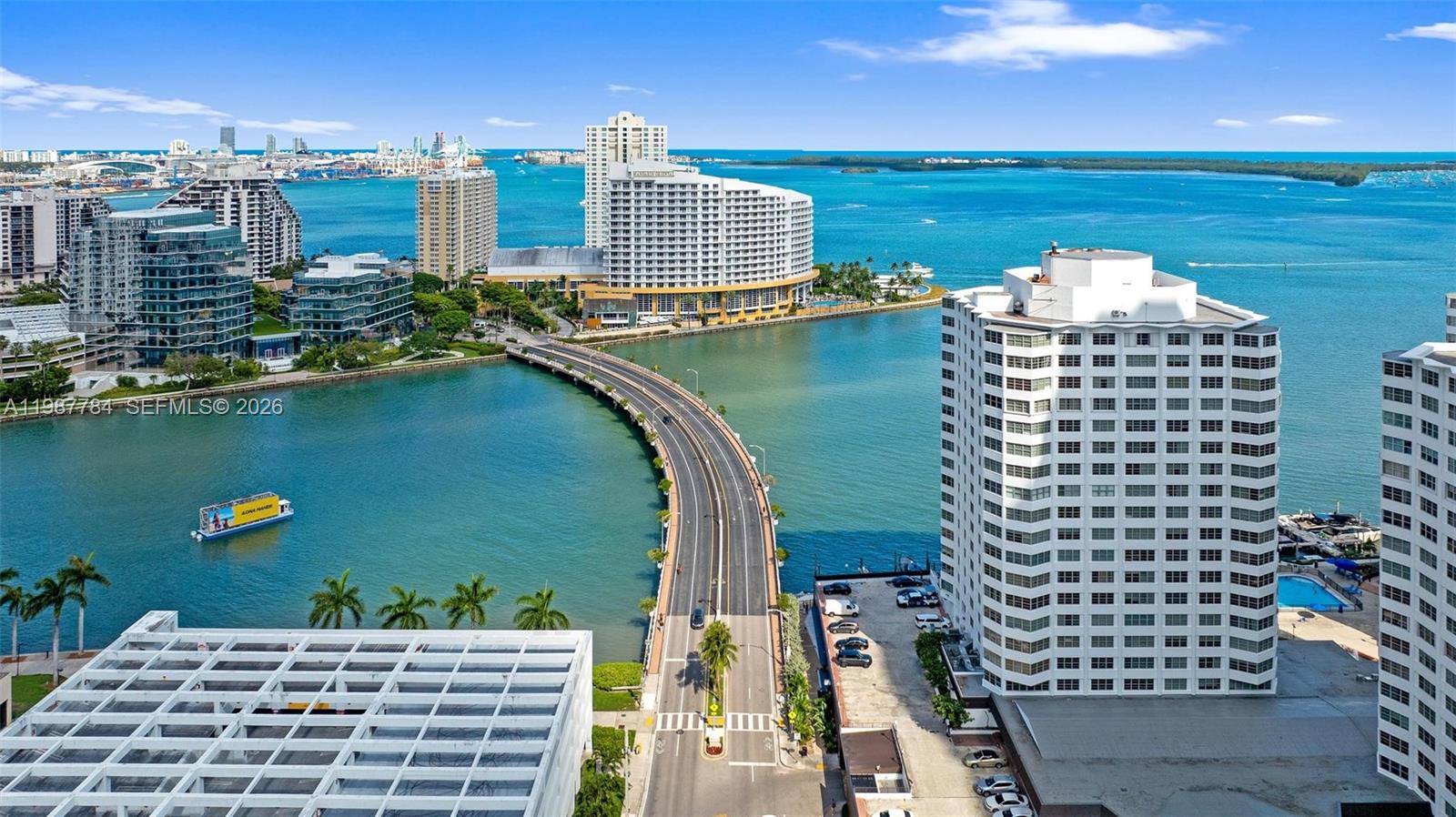An aerial view shows a bridge connecting high-rise buildings over a bay in Miami — 801 Brickell Bay Dr # 361, Miami FL 33131, MIAMI, FL