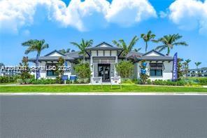 A single-story building with a dark roof, white siding, and palm trees in front — 4941 Peacock Way # 5838, Dania Beach FL 33312, DANIA BEACH, FL