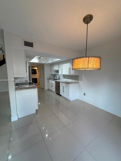 A kitchen with white cabinets, stainless steel appliances, and a hanging drum pendant light — 11543 SW 109th Rd # 24B, Miami FL 33176, MIAMI, FL