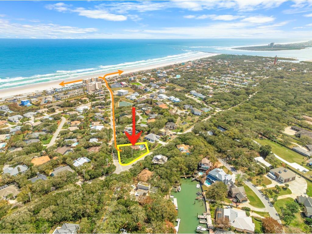 An aerial view shows a coastal residential property highlighted with a yellow outline and red arrow — 4801 S PENINSULA DRIVE, PONCE INLET, FL