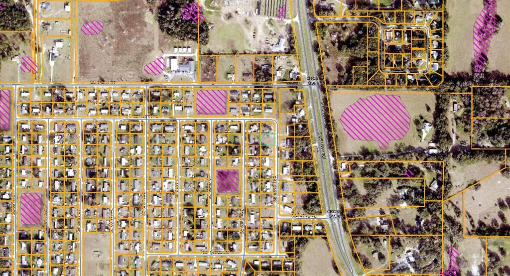 This is an aerial map showing residential lots, streets, and highlighted land parcels — 14052 SE 63RD TERRACE, SUMMERFIELD, FL