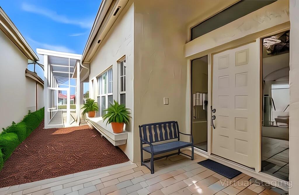 A patio entrance with a bench, potted plants, and a white door with glass panels — 10414 Osprey Trace, West Palm Beach FL 33412, WEST PALM BEACH, FL