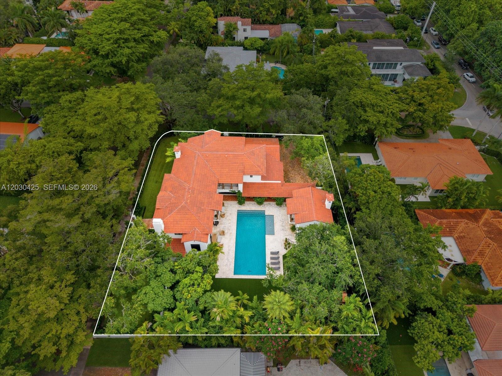 An aerial view shows a house with a red tile roof and a swimming pool — 545 San Antonio Ave, Coral Gables FL 33146, CORAL GABLES, FL
