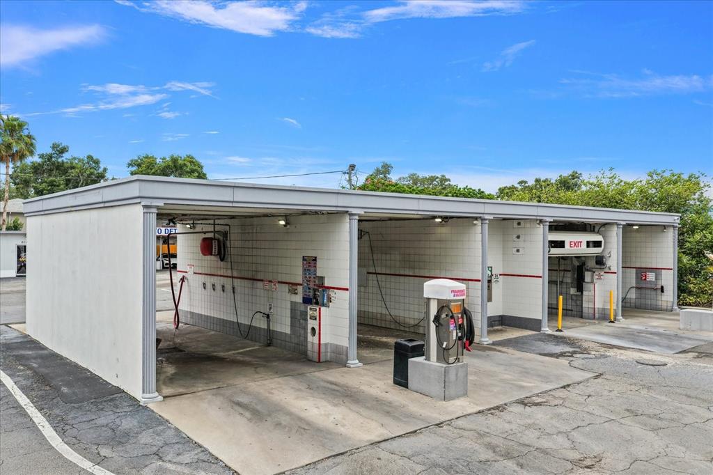 An outdoor self-service car wash facility with multiple bays and a vacuum station — 6170 54TH AVENUE N, KENNETH CITY, FL