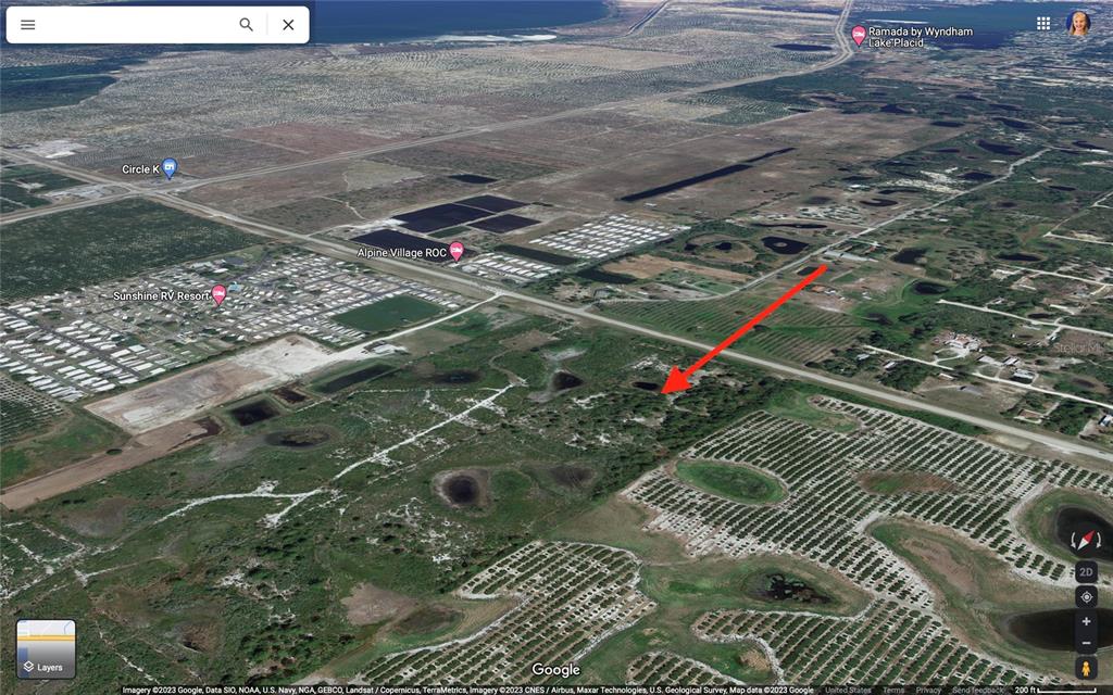 This is an aerial map view showing a plot of land near a highway — 537 STATE RD 70 E, LAKE PLACID, FL