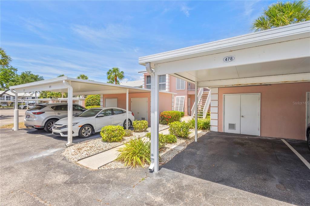 An empty room with light wood-look flooring, white walls, a ceiling fan, and sliding glass doors — 436 CERROMAR LANE UNIT 478, VENICE, FL