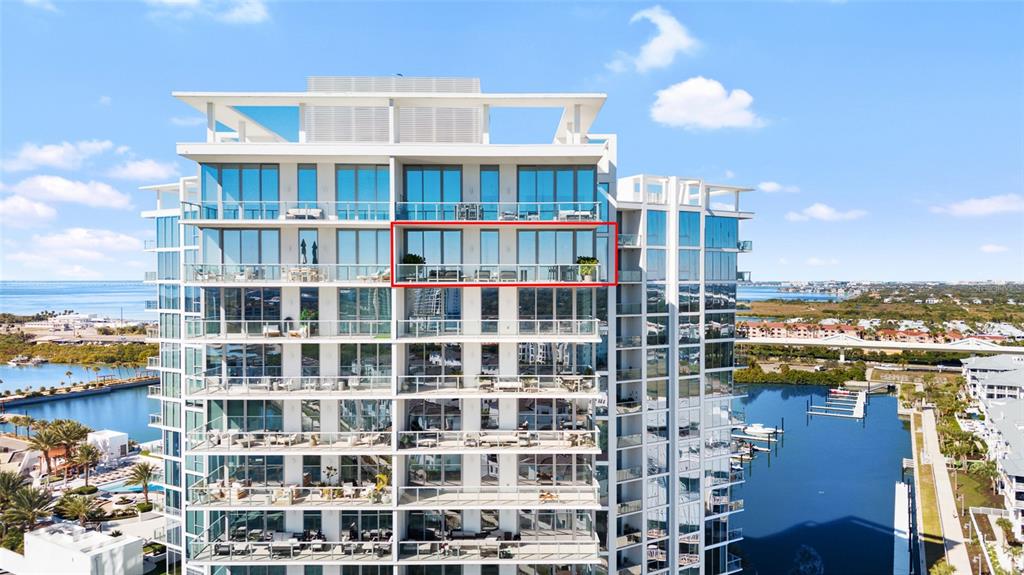 An exterior view of a high-rise residential building with a highlighted balcony unit — 5120 MARINA WAY UNIT 16005, TAMPA, FL