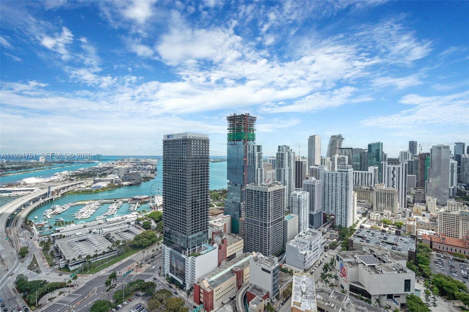 An aerial view of the Miami skyline featuring several high-rise buildings and a marina — 159 NE 6 # 4508, Miami FL 33132, MIAMI, FL