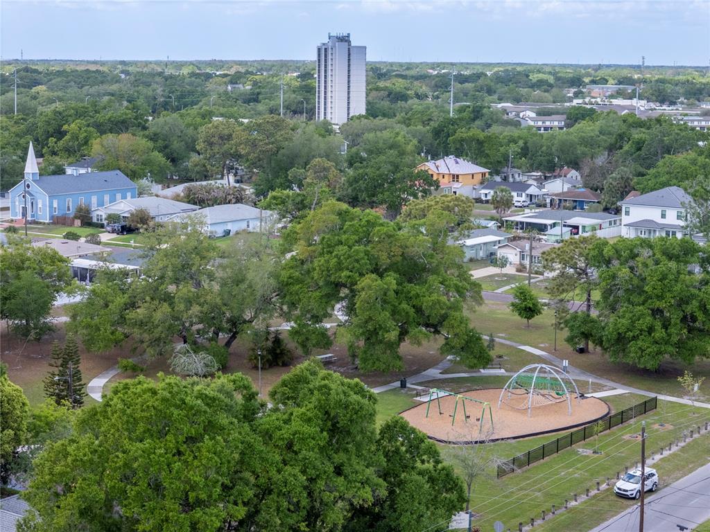 An aerial view shows a park with a playground, surrounding houses, and a tall building — 817 W OHIO AVENUE, TAMPA, FL