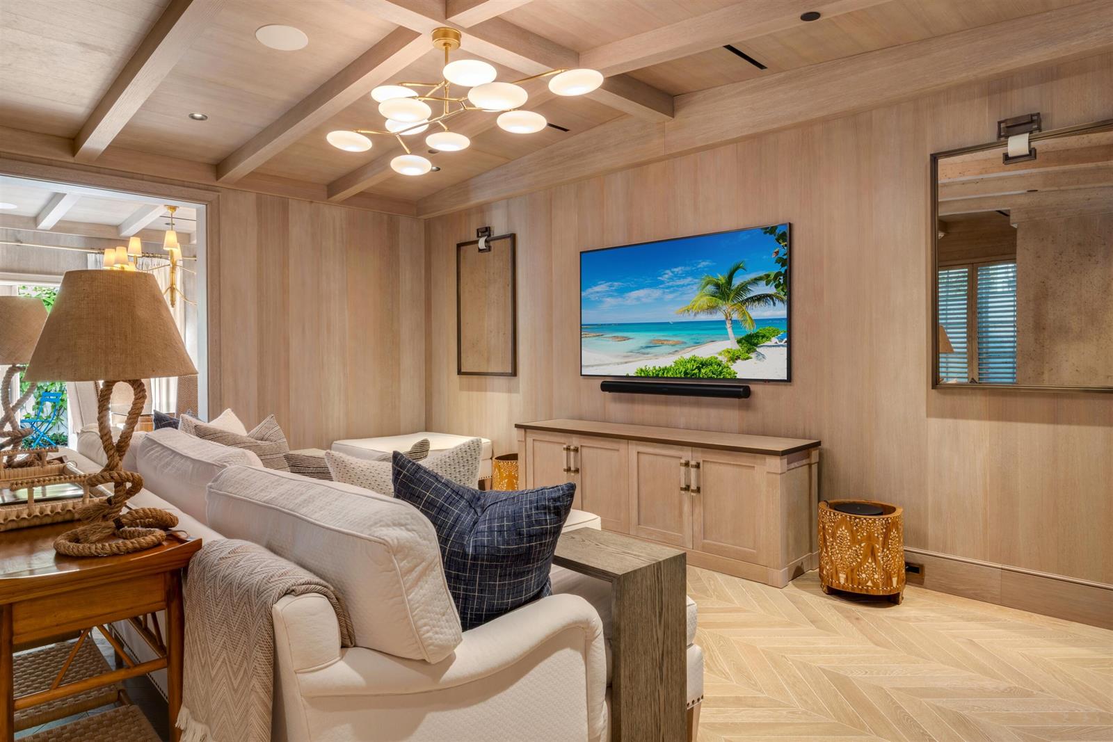 A living room features light wood walls, a coffered ceiling, and a wall-mounted television — 238 Phipps Plaza, Palm Beach FL 33480, PALM BEACH, FL