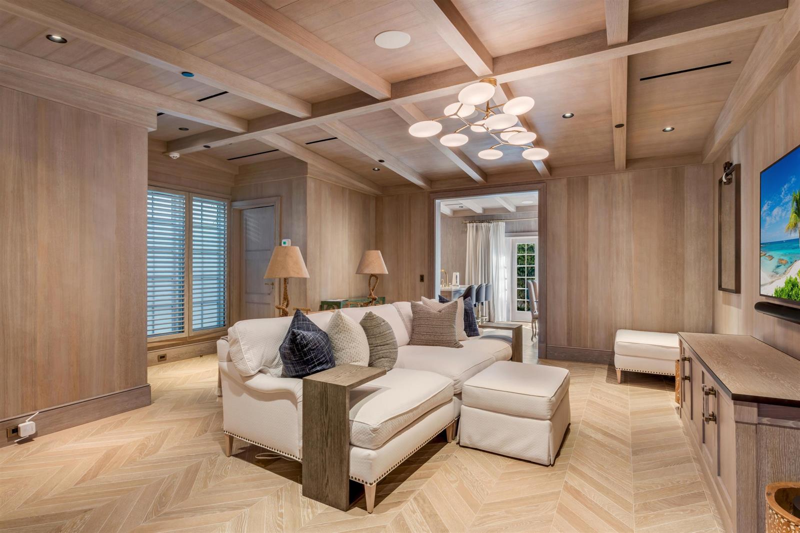 A living room features light wood paneling, a coffered ceiling, and herringbone patterned wood floors — 238 Phipps Plaza, Palm Beach FL 33480, PALM BEACH, FL
