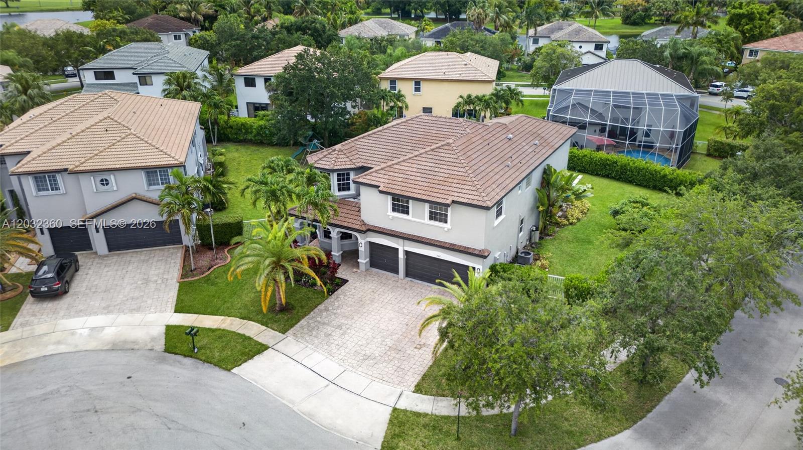 An aerial view shows two-story suburban houses with tile roofs, driveways, and landscaped yards — 2167 SW 176th Ter, Miramar FL 33029, MIRAMAR, FL