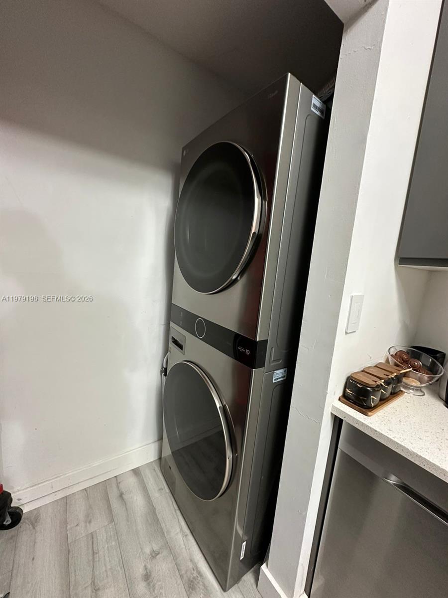 A stacked LG washer and dryer unit is installed in a small laundry alcove — 931 NE 199th St # 22, Miami FL 33179, MIAMI, FL